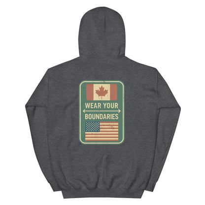 Maroon hoodie with a 'Canadian Shield | Boundaries' road sign bold graphic on back by State Limit Apparel.