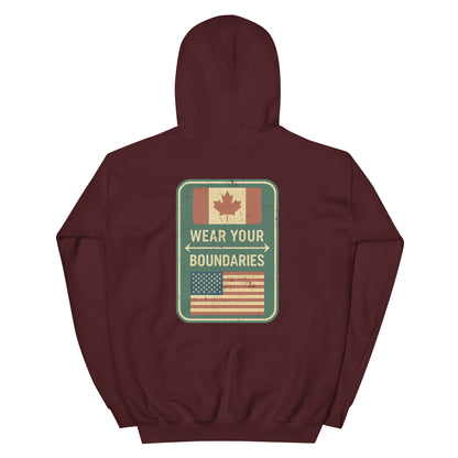 Maroon hoodie with a 'Canadian Shield | Boundaries' road sign bold graphic on back by State Limit Apparel.