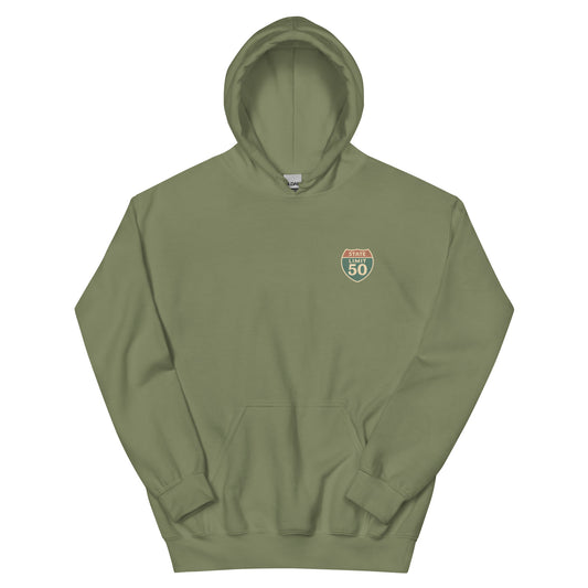 Military Green graphic hoodie with a 'Canadian Shield | Boundaries' road sign crest on front by State Limit Apparel.