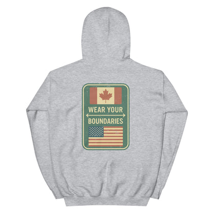 Sport grey hoodie with a 'Canadian Shield | Boundaries' road sign bold graphic on back by State Limit Apparel.