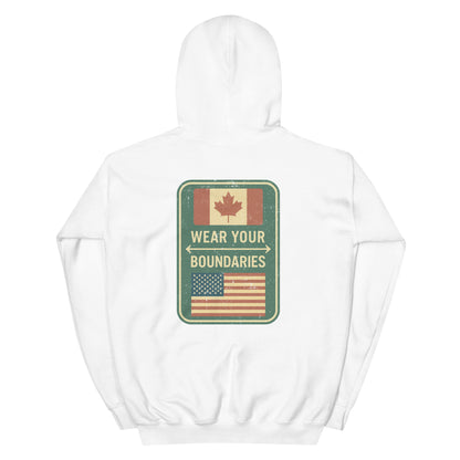 White hoodie with a 'Canadian Shield | Boundaries' road sign bold graphic on back by State Limit Apparel.