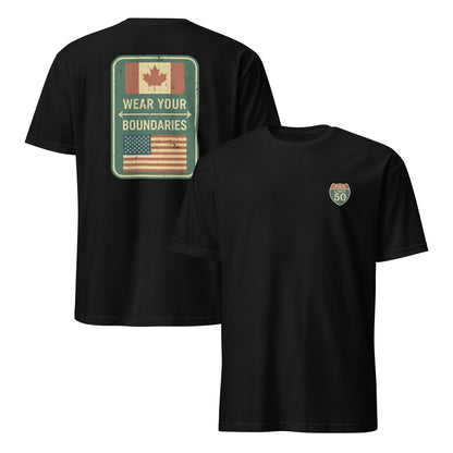 Black graphic t-shirt with a 'Canadian Shield | Boundaries' road sign design by State Limit Apparel.
