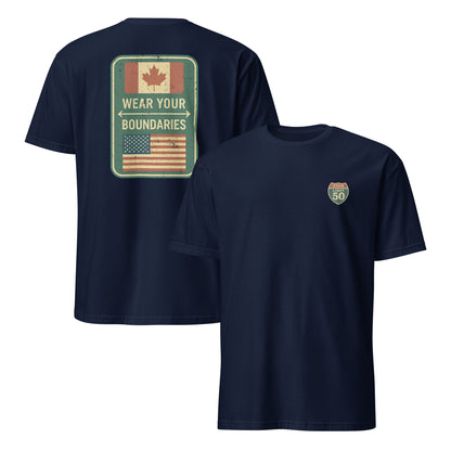 Navy blue graphic t-shirt with a 'Canadian Shield | Boundaries' road sign design by State Limit Apparel.