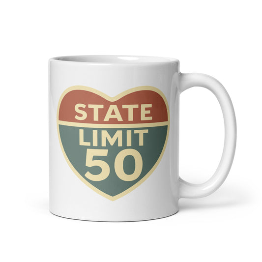 White ceramic mug with 'Love the Limit | Love Canada' road sign inspired graphic by State Limit Apparel.