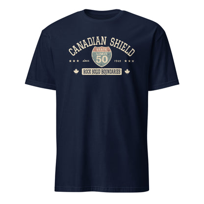 Navy blue graphic t-shirt with a 'Canadian Shield | Rock Solid' road sign design by State Limit Apparel.