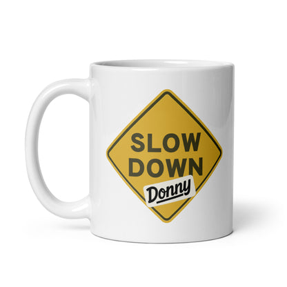 White ceramic mug with a 'Slow Down, Donny | We Have Our Limit Too' graphic by State Limit Apparel.