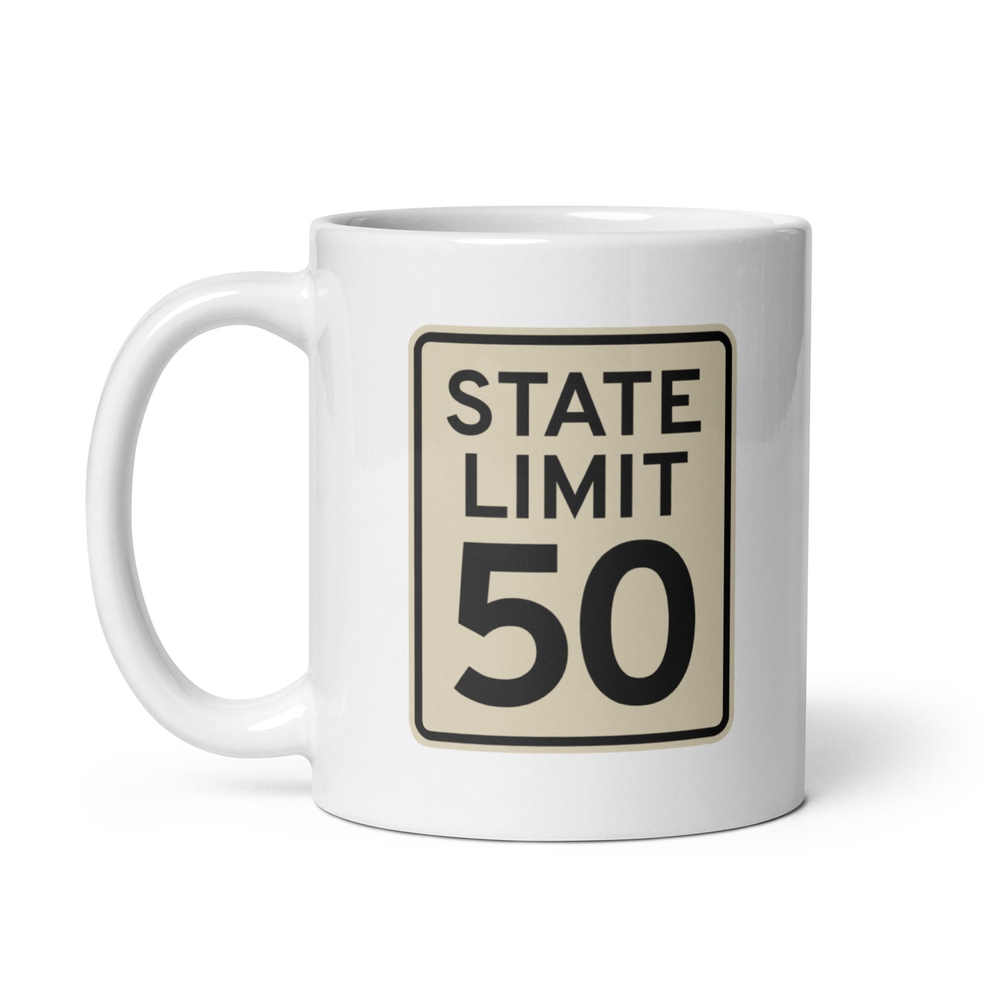 White ceramic mug with a 'State Limit | Keep Canada Canadian' road sign graphic by State Limit Apparel.