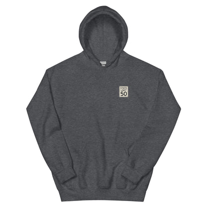 Dark Heather hoodie front with a 'State Limit | Keep Canada Canadian' road sign graphic crest by State Limit Apparel.