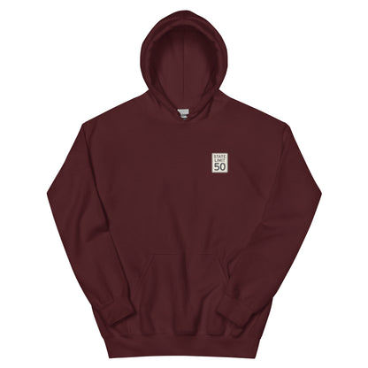 Maroon hoodie front with a 'State Limit | Keep Canada Canadian' road sign graphic crest by State Limit Apparel.