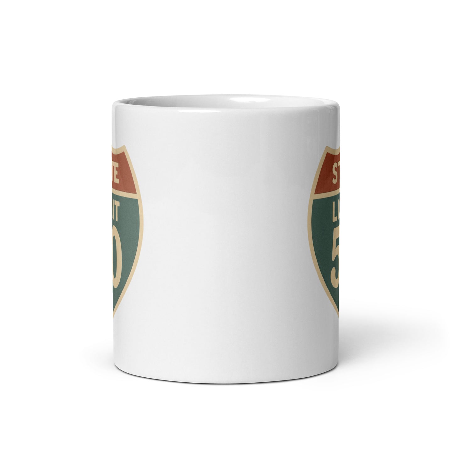 View of white ceramic mug with road sign graphic by State Limit Apparel to both sides.