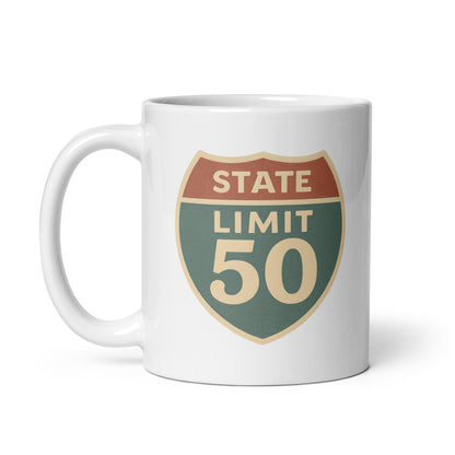 White ceramic mug with a retro 'Canadian Shield | On Guard for Thee' graphic by State Limit Apparel.
